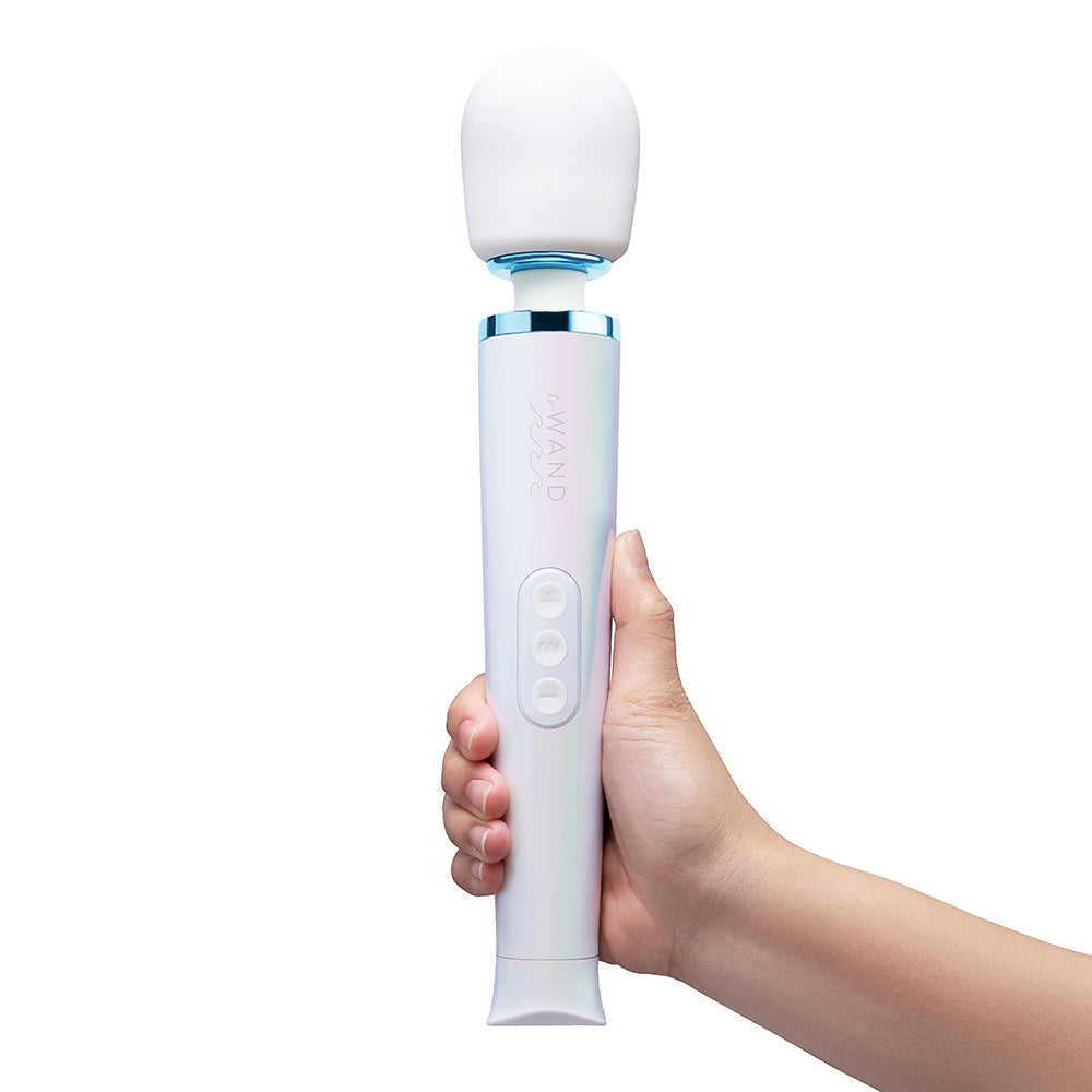 Le Wand Dive Submersible Vibrating Massager Seashell in hand, showcasing ergonomic design and silicone head.