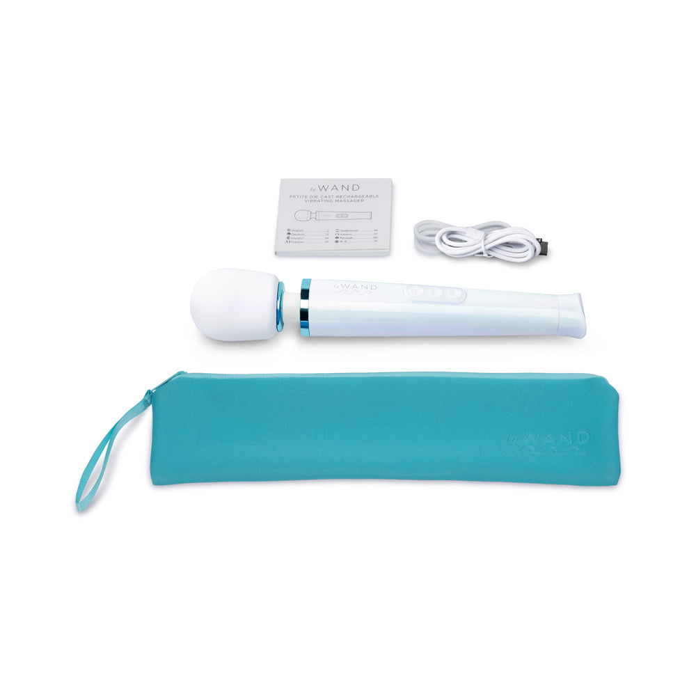 Le Wand Dive Submersible Vibrating Massager Seashell with accessories including charging cable and storage pouch.