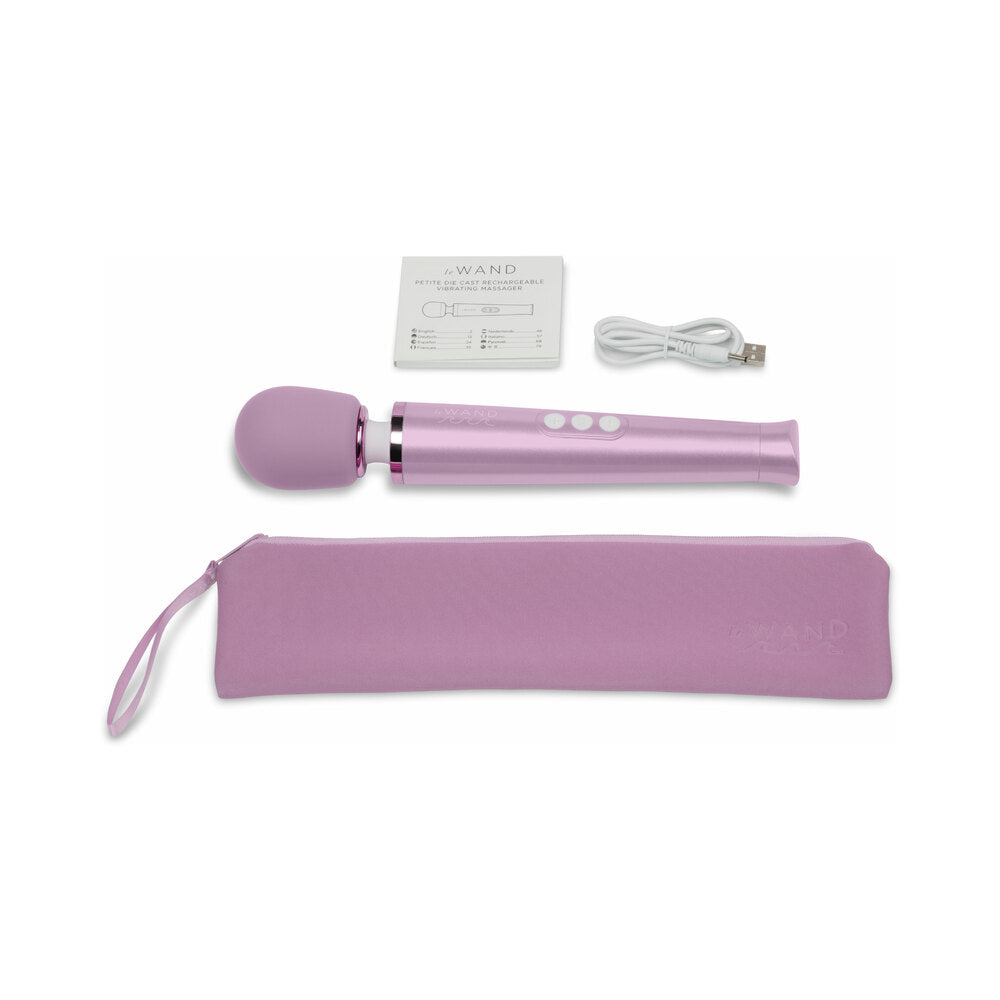 Le Wand Dive Submersible Vibrating Massager Lavender with accessories, including charger and storage pouch.