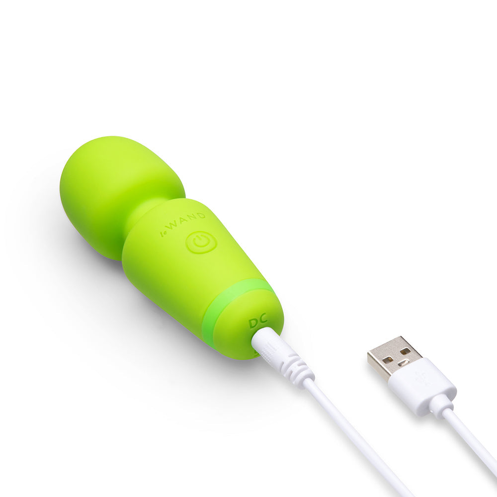 Le Wand Essentials Mini Wand Vibe Pocket-sized Vibrator in vibrant green with USB charging cable.