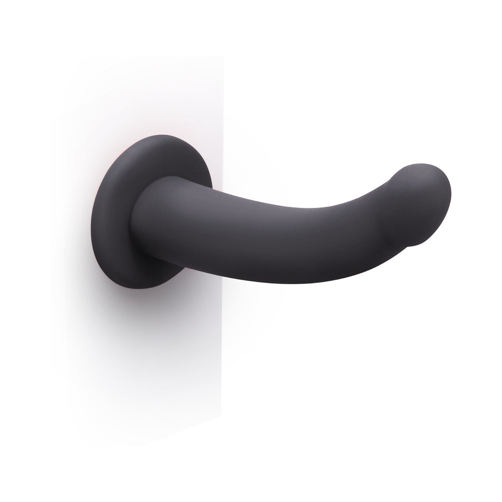 b-Vibe Essentials 7 Inch Smooth Silicone Dildo Black with a sleek, non-phallic design, perfect for solo or partnered play.
