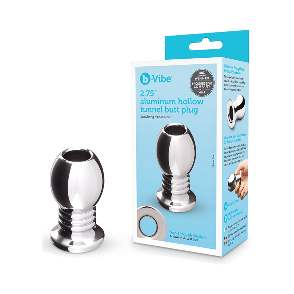 B-vibe Essentials 2.75 Inch Aluminum Hollow Tunnel Butt Plug in packaging showcasing its sleek design.