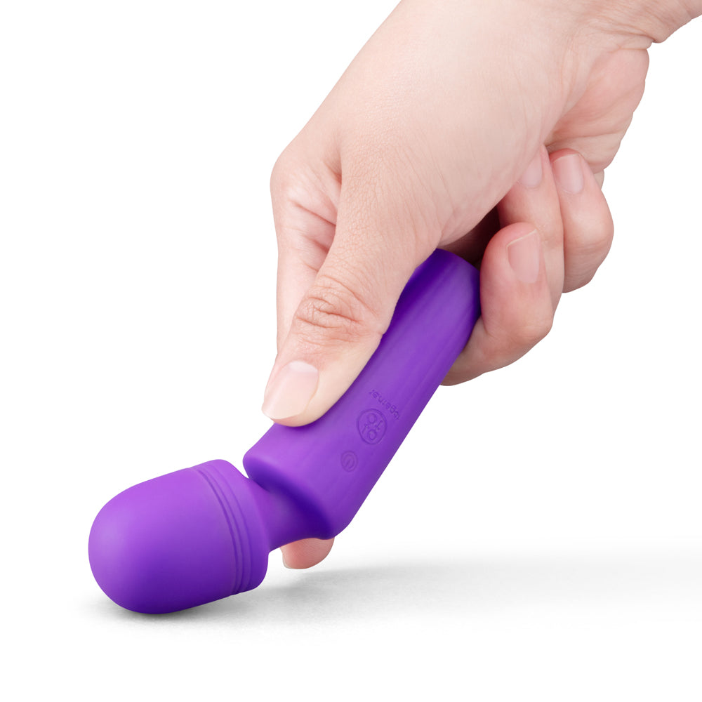 Together Glow On The Go Mini Wand Vibrator Purple held in hand, showcasing its compact design and soft silicone finish.