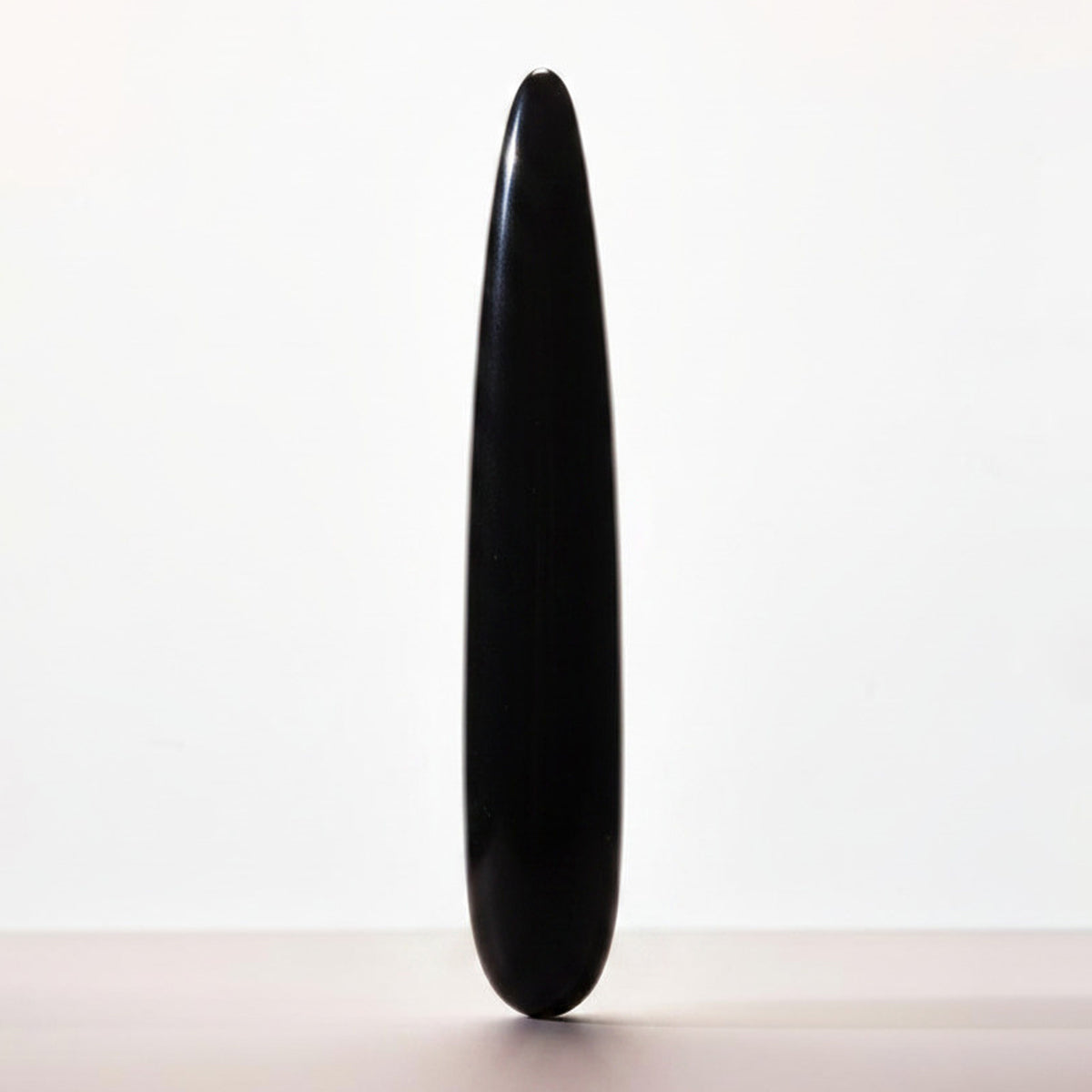 Chakrubs Xaga Slim Non-Phallic Dildo in sleek black design, perfect for beginners and experienced users.