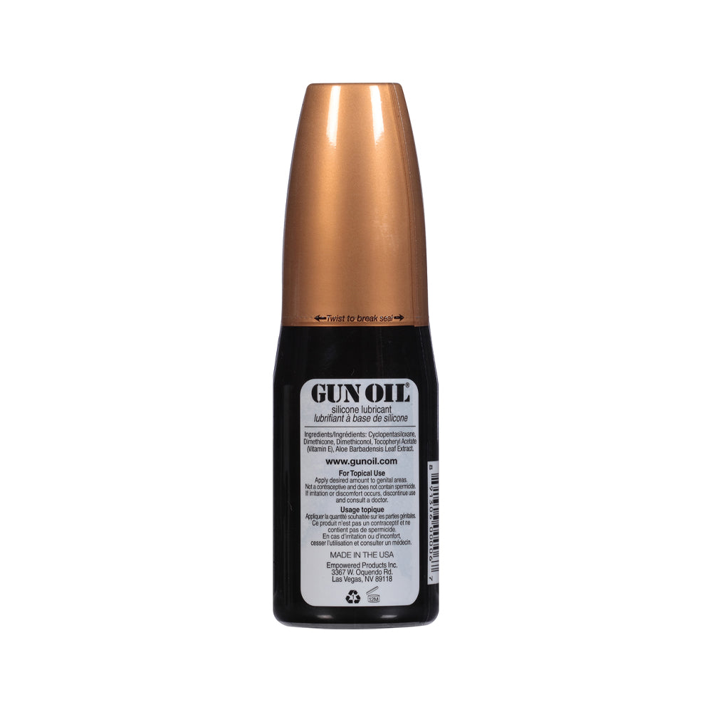 Gun Oil Silicone Lubricant 4 Oz bottle with a copper top, featuring product information and usage instructions.