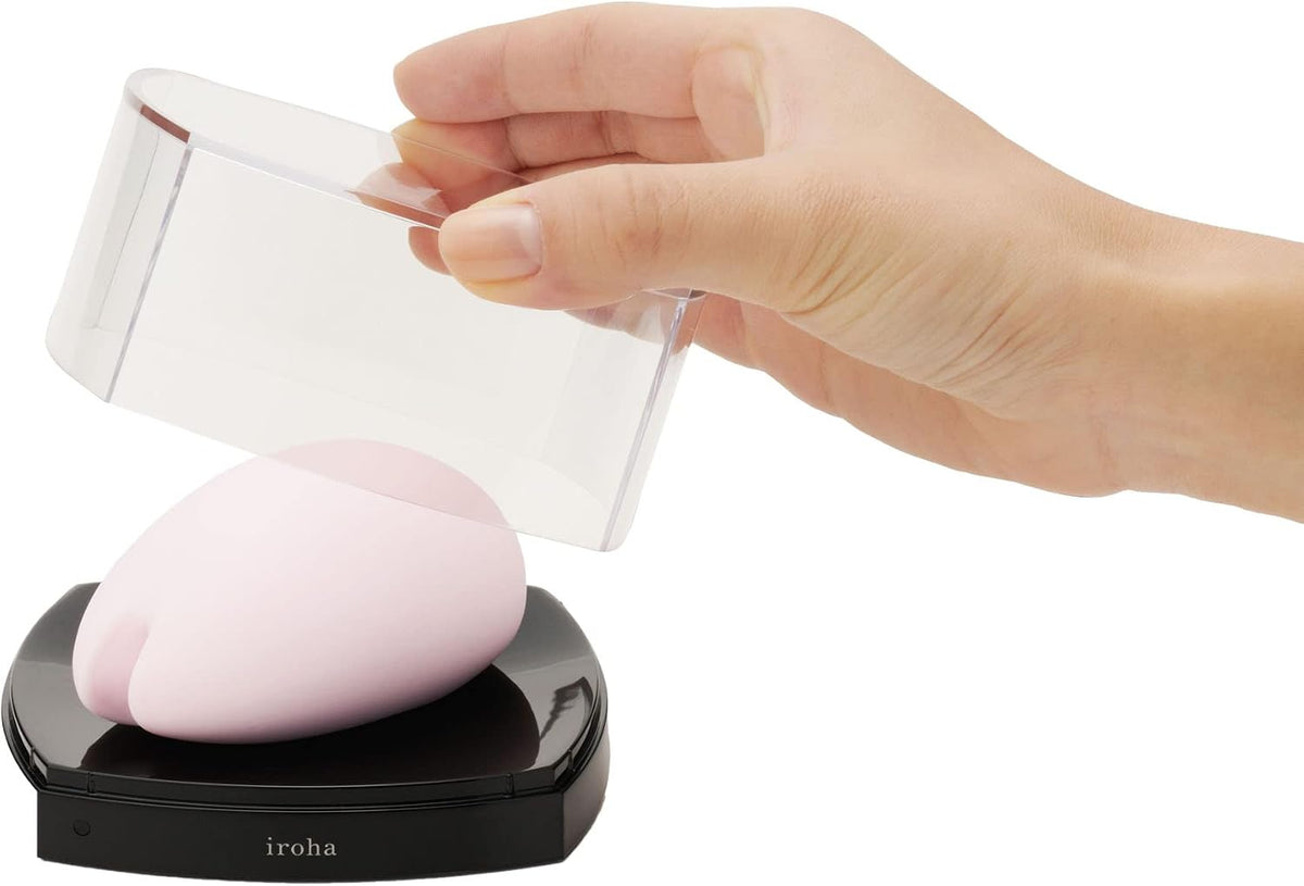 Unboxing Tenga Iroha Sakura Silicone Mini Vibe Pink with a clear case being removed.