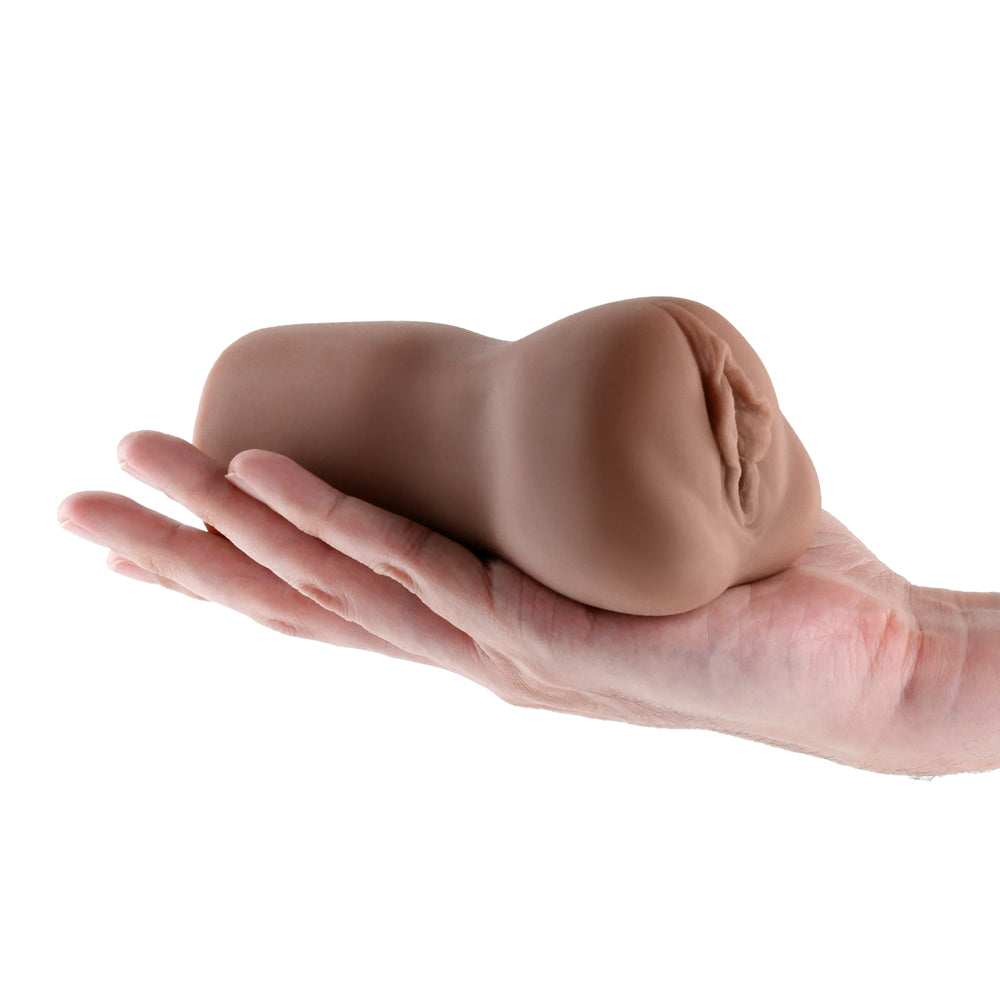 Hustler's Barely Legal Raven Stroker Brown in a hand, showcasing ultra-lifelike sensation and compact design.