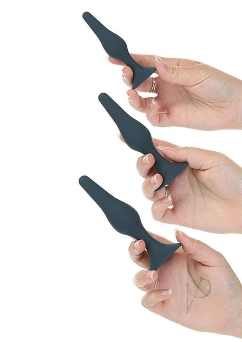 LUX Active Equip Anal Explorer Kit Blue featuring three silicone plugs in graduated sizes held in hands.