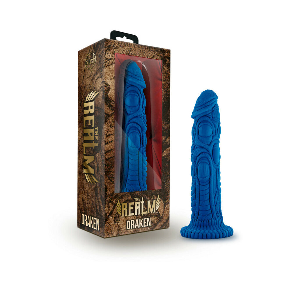 The Realm Draken 7.5 inch Silicone Lock On Fantasy Dildo Blue in packaging, showcasing dragon-skin texture and vivid color.