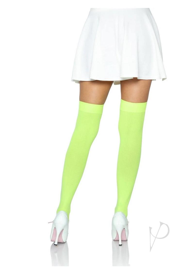 Leg Avenue Nylon Over The Knee Socks One Size Neon Green worn with a white skirt and heeled shoes.