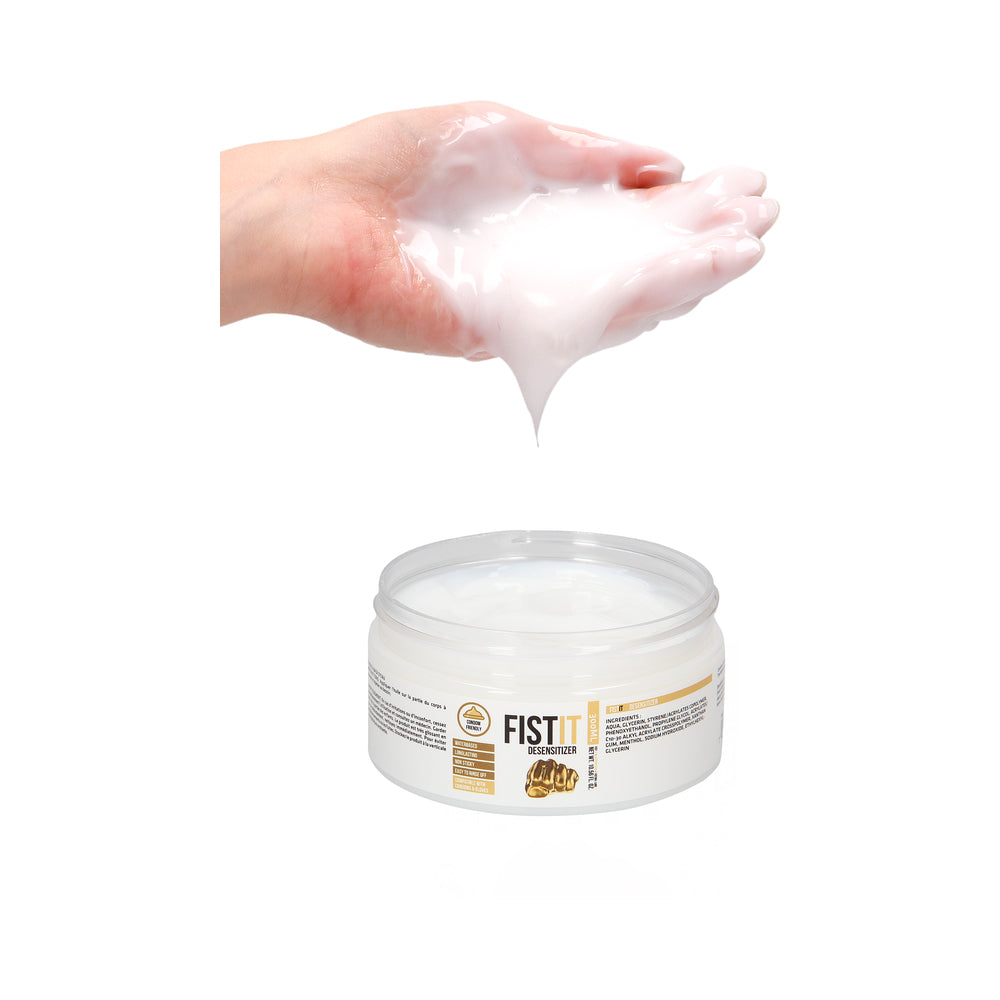Fist It Numbing Water-Based Fisting Lube 300 ml pouring from hand, showcasing its smooth texture and packaging.