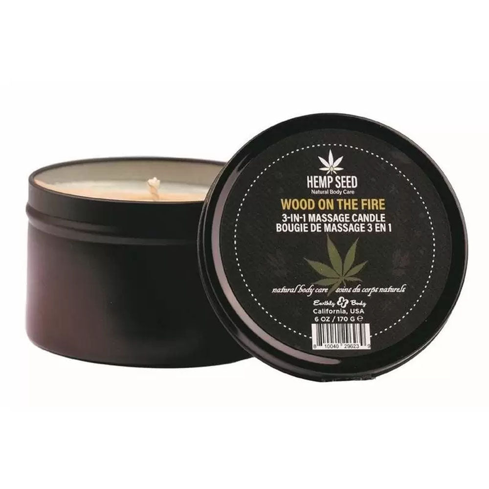 Hemp Seed 3-in-1 Holiday Candle Wood On The Fire 6 Oz in a stylish black container with natural body care branding.