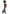 Leg Avenue Worship Me Cross Net Thigh Highs Black modeled with high heels against a black skirt.