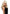 Pleasure Wigs Collection Joey Wig Blonde worn by a model with glamorous blonde hair and stylish makeup in a black outfit.