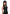 Pleasure Wigs Collection Amber Wig Black worn by model in black corset with long, deep black hair and stylish bangs.
