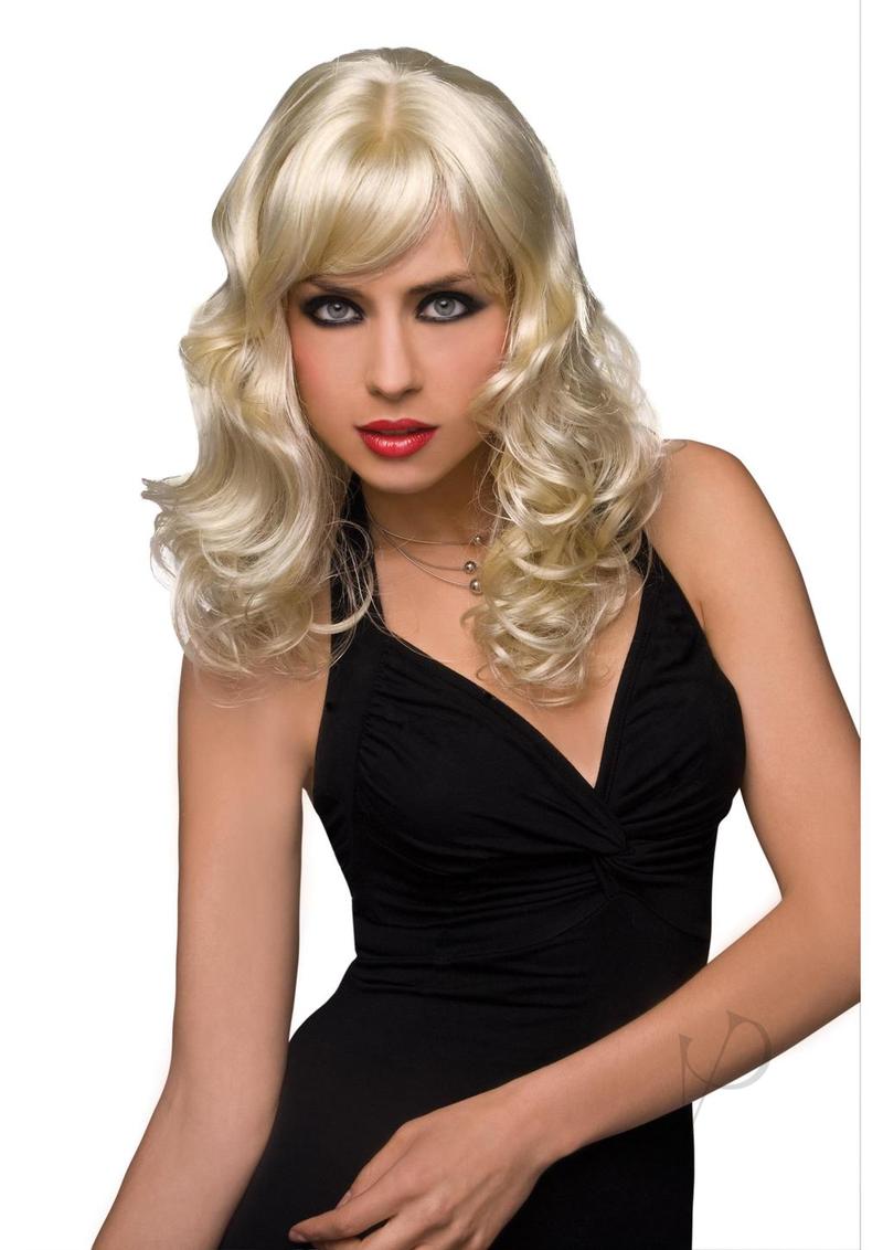 Pleasure Wigs Collection Aubrey Wig Blonde worn by a model with glamorous curls and a chic black dress.
