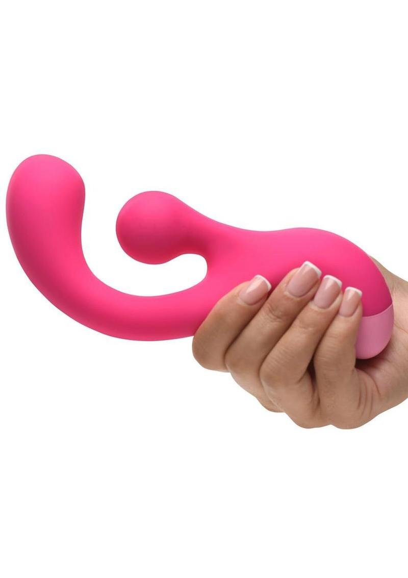 Bang Gyro Rabbit Silicone Vibrator Pink held in hand, showcasing its ergonomic design and vibrant color.