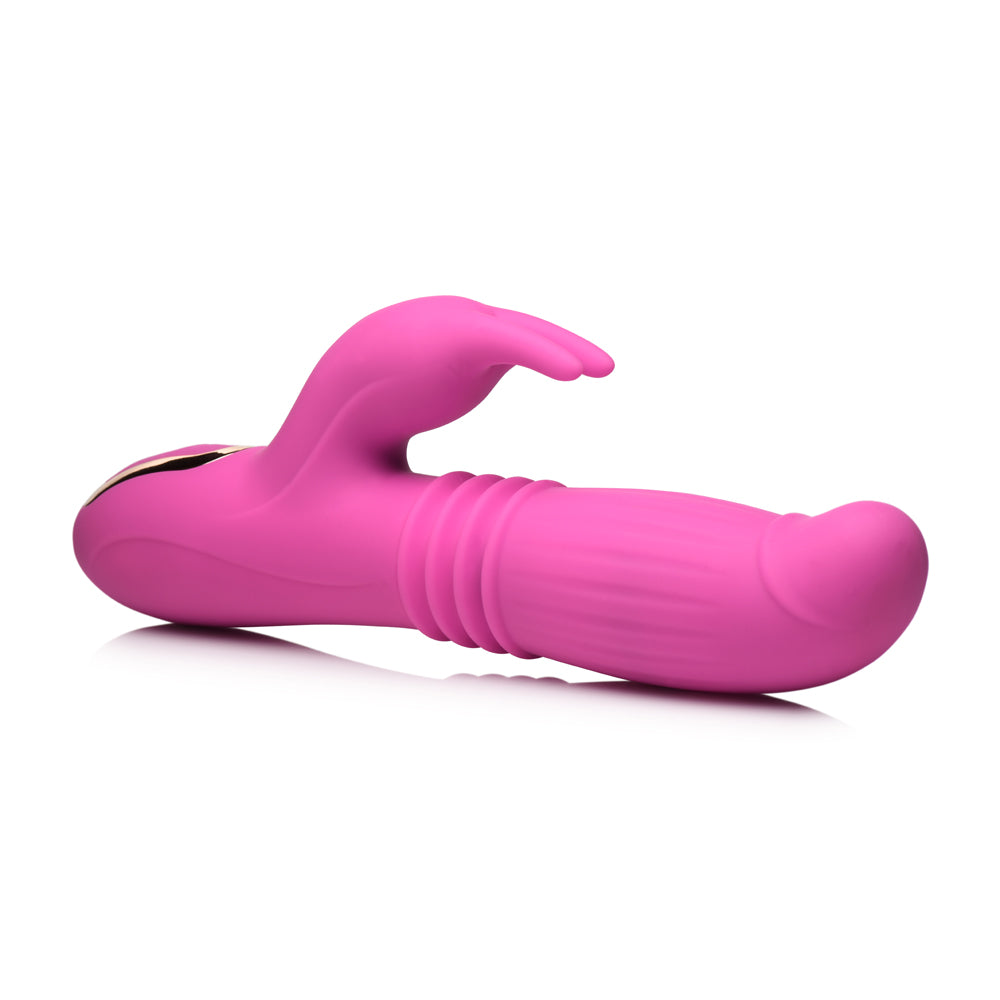 Inmi 35x Lil Swell Thrusting & Swelling Rabbit Vibrator in vibrant pink color, showcasing its ergonomic design and functions.
