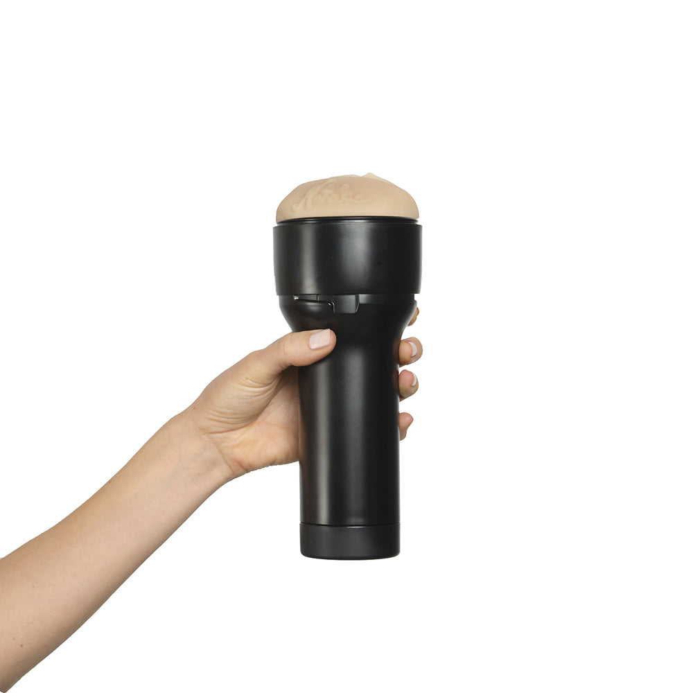 Feel Natalia Starr Stroker By Kiiroo held in hand, showcasing its design and intimate features.