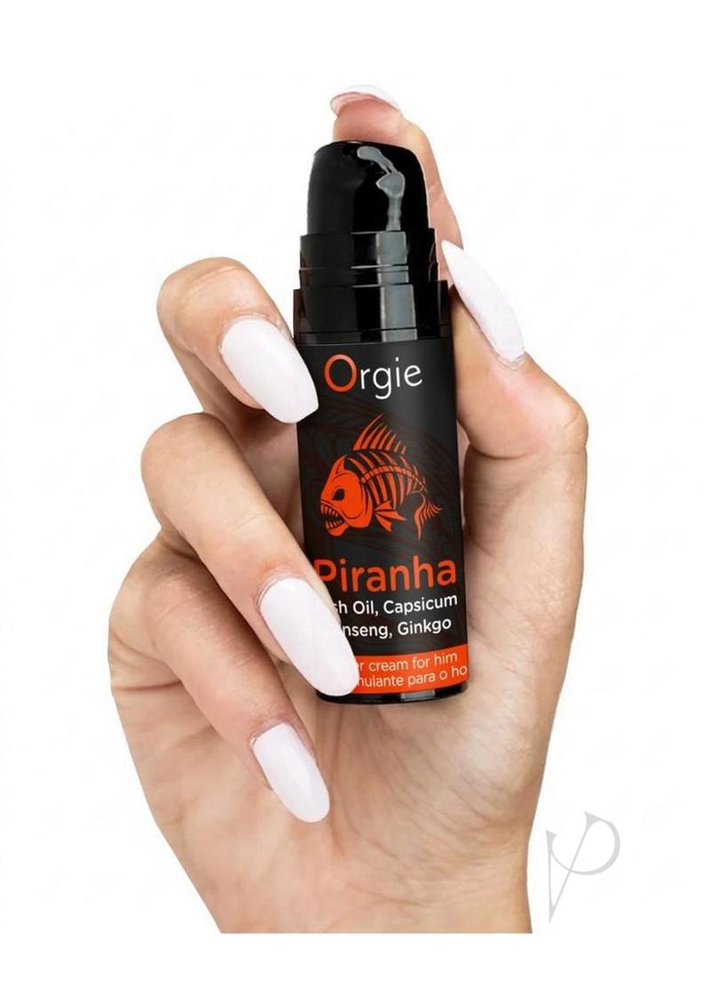 Orgie Piranha Power Cream for Him 0.5 Oz held in hand, promoting arousal and confidence.