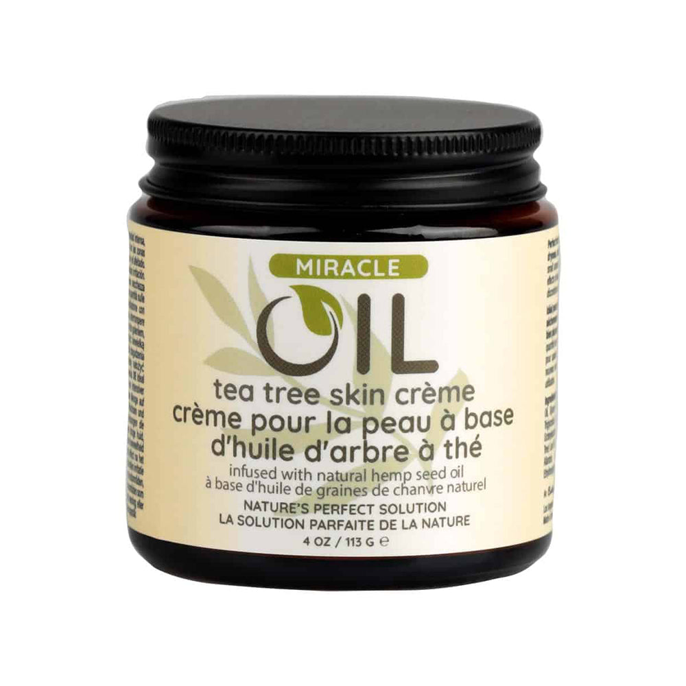 Earthly Body Miracle Oil Tea Tree Creme 4 Oz jar with label detailing tea tree skin care benefits.