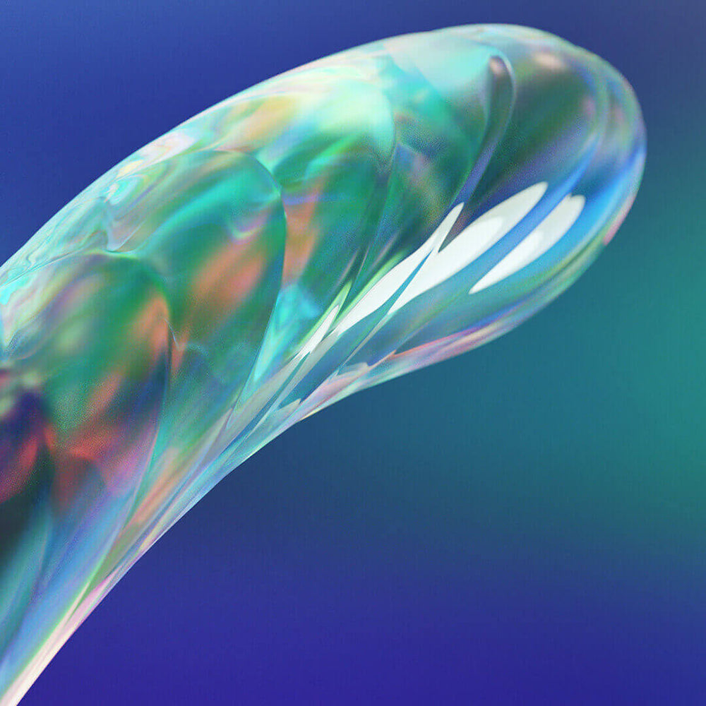 Close-up of the Biird Kalii Glass G-spot Dildo highlighting its elegant design and smooth, colorful surface.