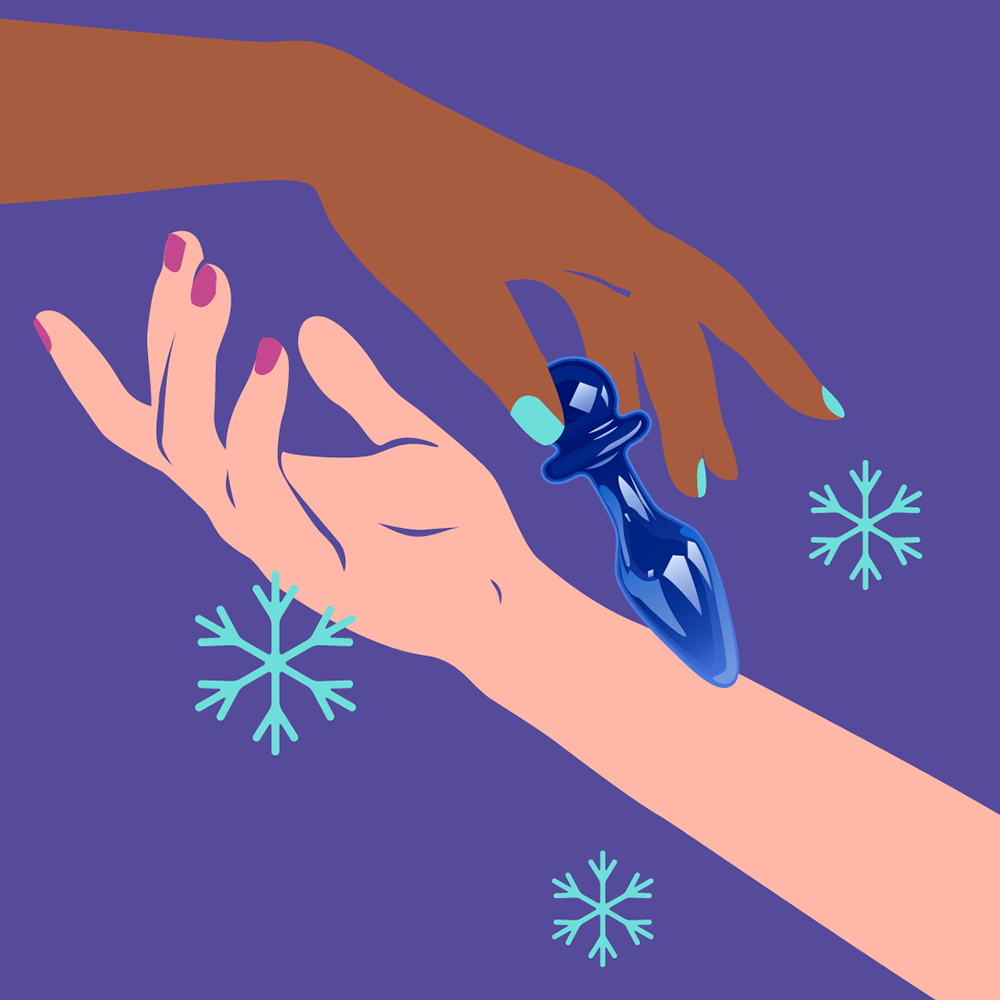 Two hands reaching for a Biird Anii Glass Anal Plug on a purple background with snowflakes.