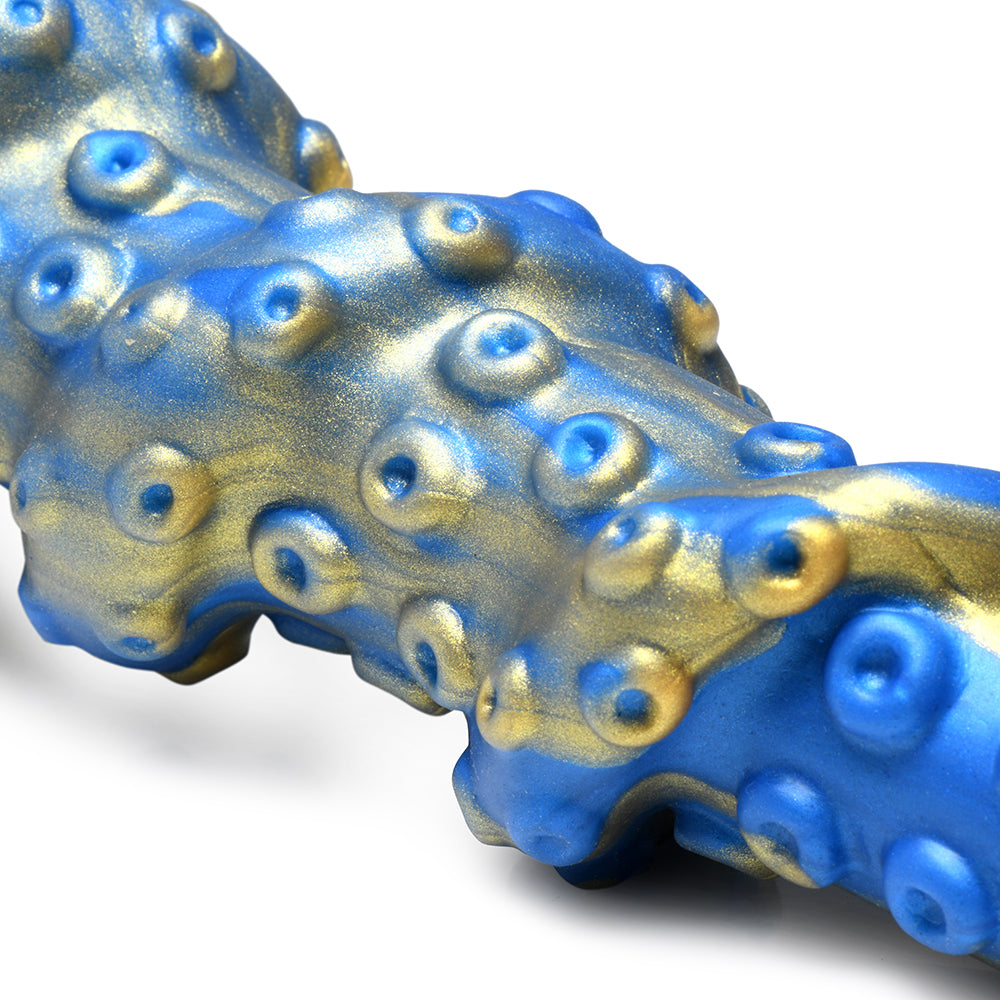 Creature Cocks Kraken Silicone Dildo showcasing vivid blue and gold textures, designed for immersive pleasure.