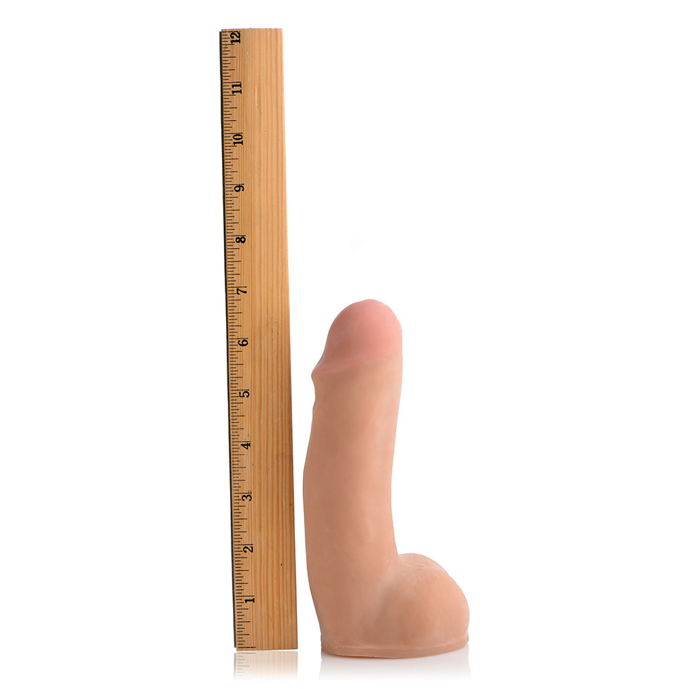 Loadz Dual Density Squirting Dildo Light 7 inches next to a ruler for size comparison.