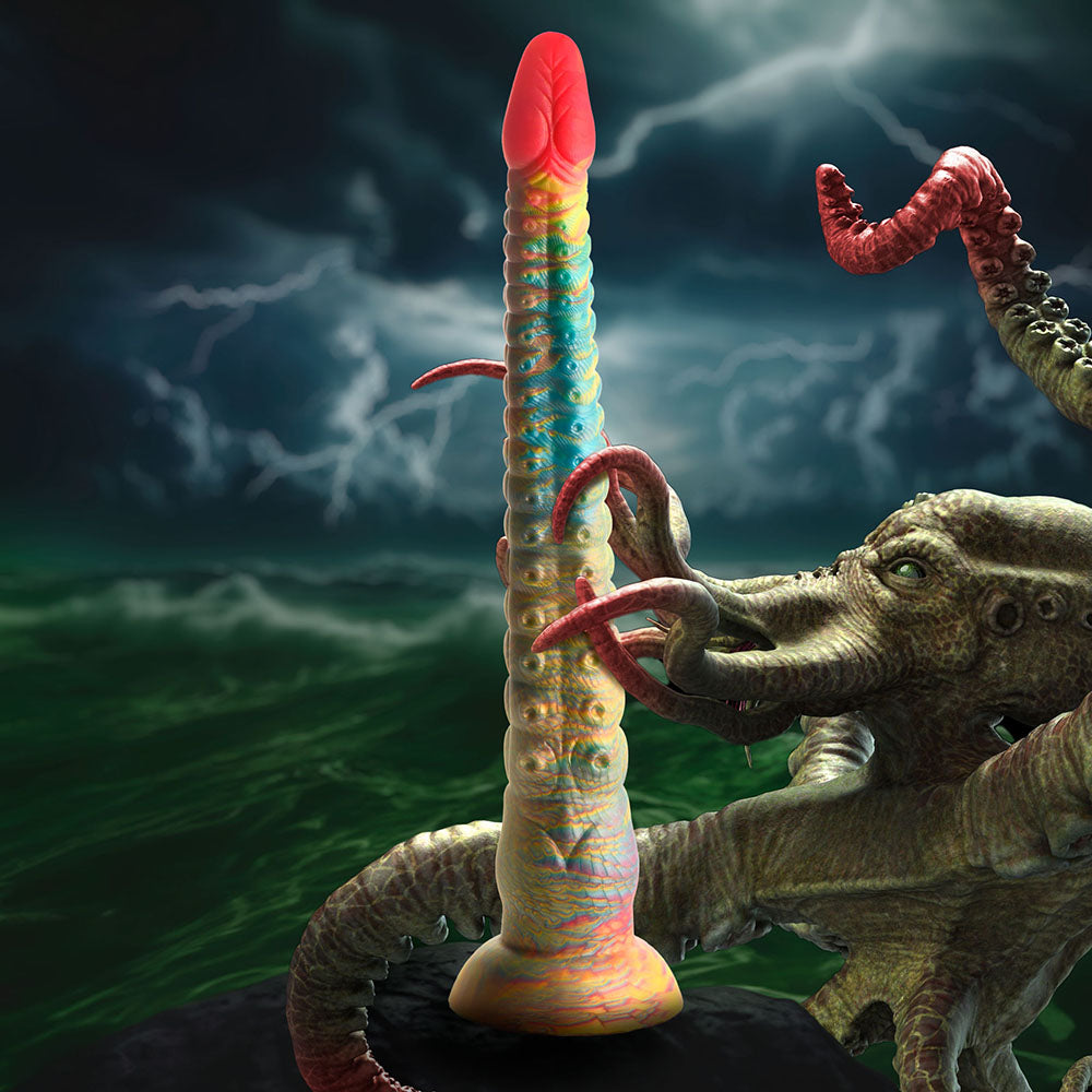 Creature Cocks Tenta-Dick Tentacle Silicone Dildo with colorful design against a dark, stormy background.