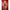 Fantasy Lingerie Play Wild Card Jester Costume Set Red L/XL showcased on a model from the back, emphasizing the glossy colorblock design.