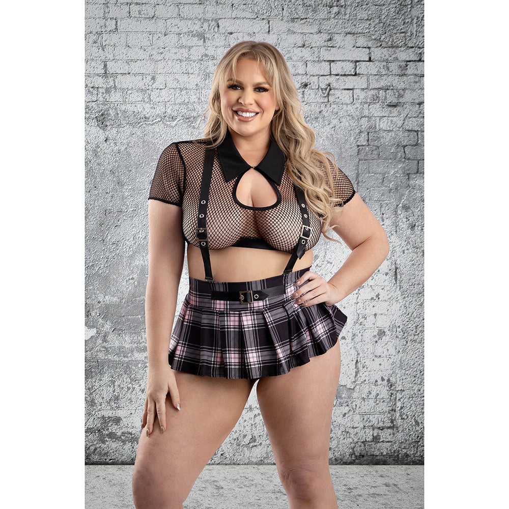 Fantasy Lingerie Skipping Class School Girl Costume 3XL/4XL model wearing fishnet top and pleated skirt against a brick wall.