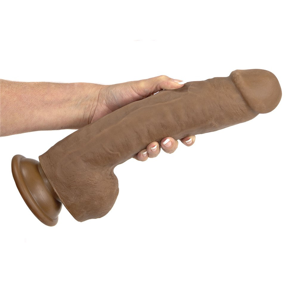 Adam & Eve Adam's Colossal 12 Inch Dildo Brown held in hand, showcasing its realistic design and size.