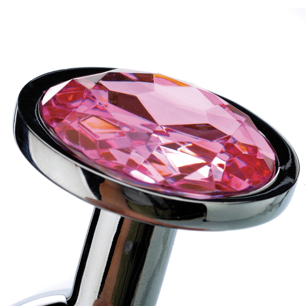 Close-up of the Adam & Eve Pink Gem Anal Plug Large showcasing its striking pink gemstone detail.