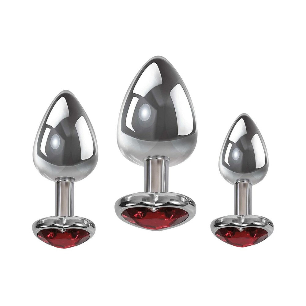 Adam & Eve Three Hearts Gem Anal Plug Set featuring three polished metal plugs with heart-shaped jewel bases.