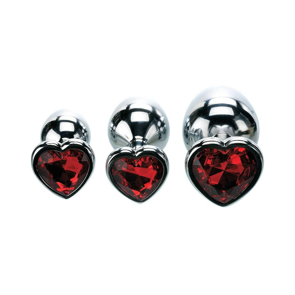 Adam & Eve Three Hearts Gem Anal Plug Set featuring polished metal plugs with sparkling heart-shaped jewel bases.