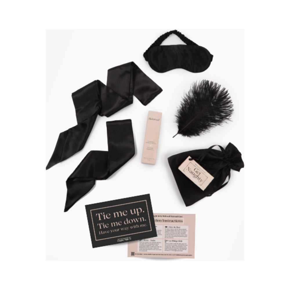 Beloved Naughty Night In Gift Set featuring sensual accessories like a blindfold, feather, and guiding instructions.