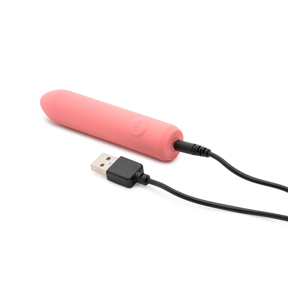 Je Joue ILy The Bullet Squishy Classic Vibrator charging with USB connection in soft pink design.