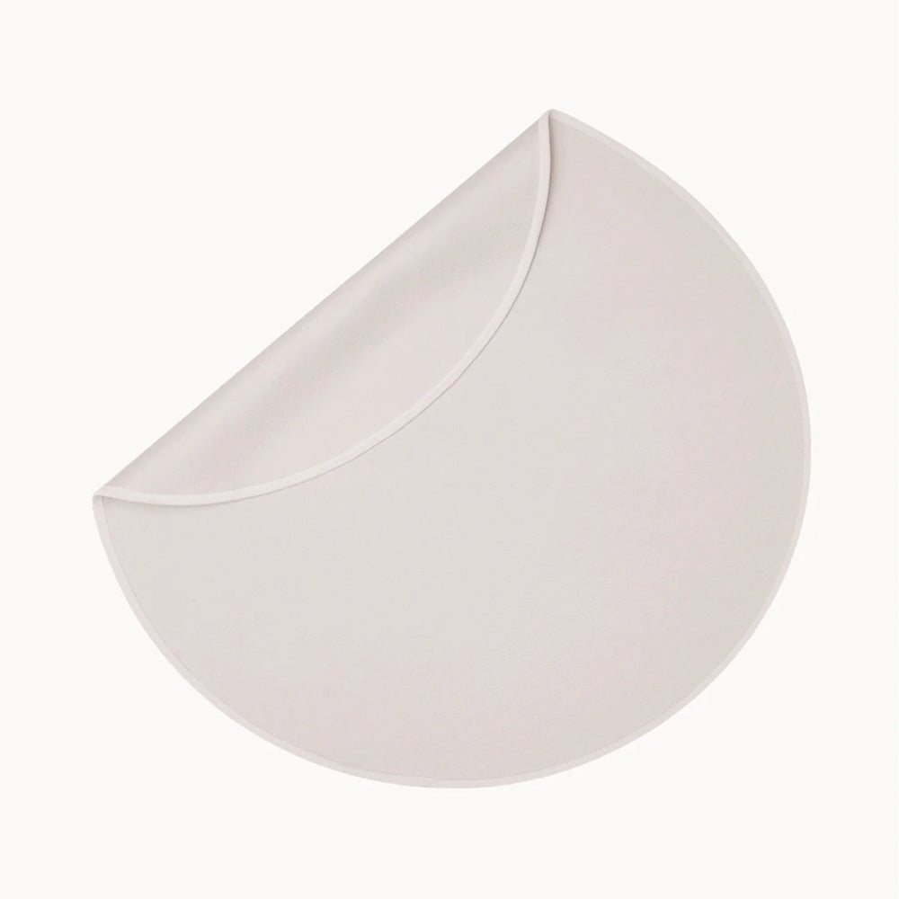 Dame Thro Waterproof Blanket for Play Oat in a soft, light color, designed for comfort and protection.