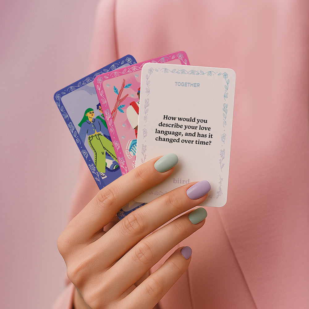 Biird X Jouissance Club Together Couples Card Game showing colorful question cards to deepen connections.