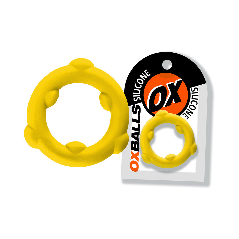 Oxballs Spinner Single Silicone Ring Yellow with packaging, showcasing its durable design and bright yellow color.