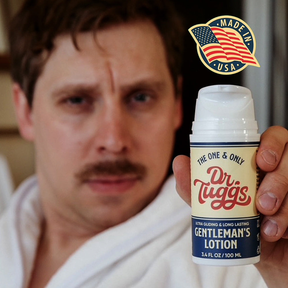 Dr Tuggs Gentlemans Masturbation Lotion 3.4 Oz in a man's hand, showcasing smooth texture and premium quality.