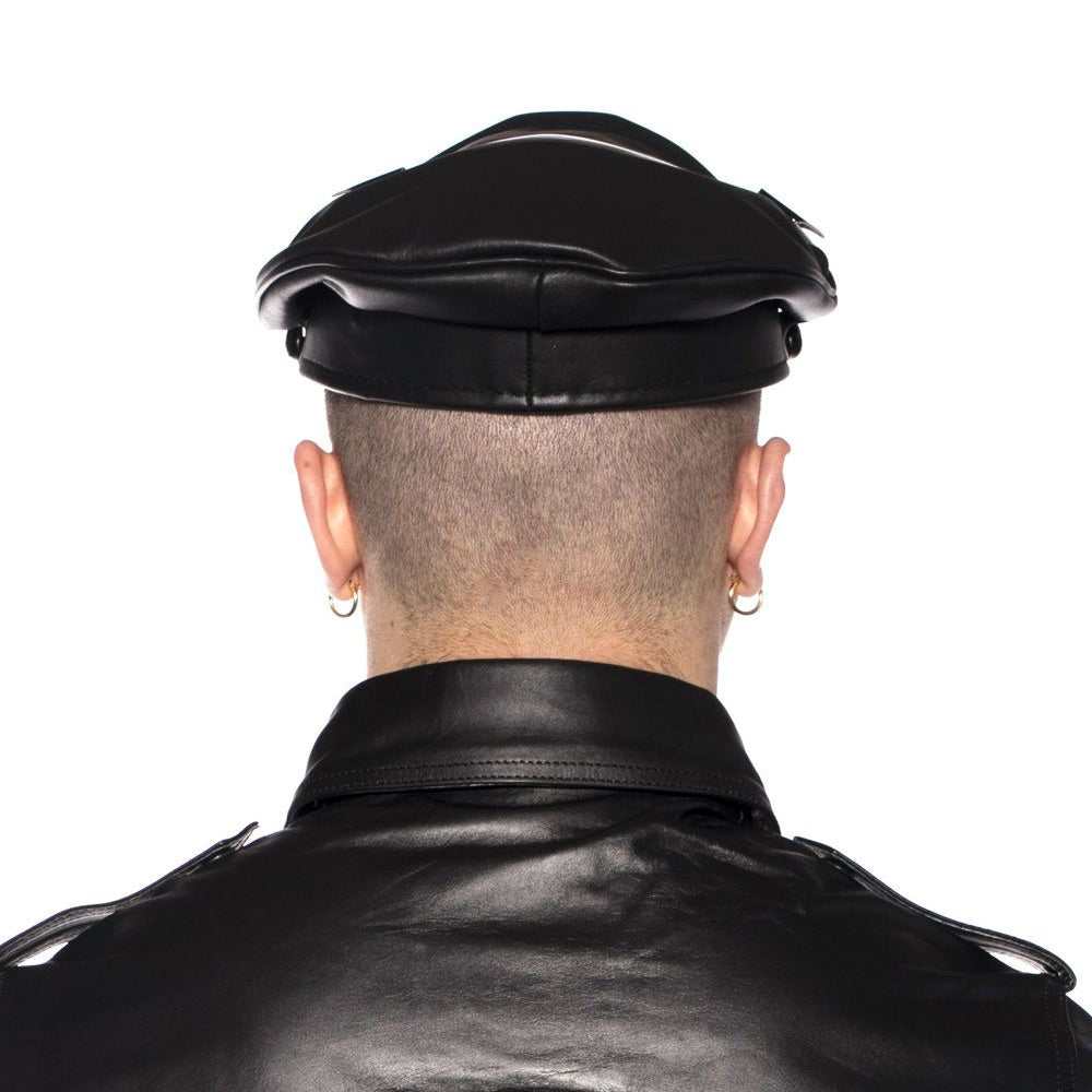 Back view of a person wearing the Prowler RED Military Cap Black 61 cm XL with a leather jacket.