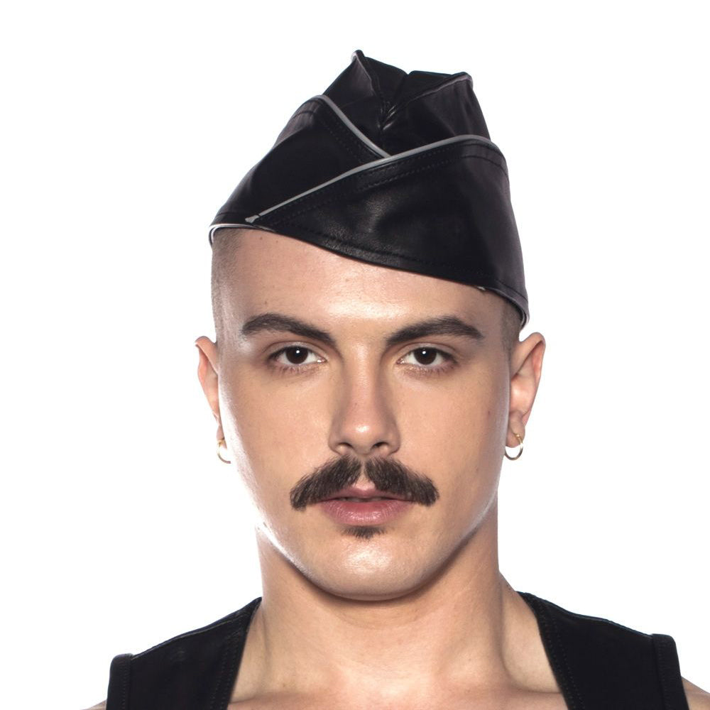 Model wearing Prowler RED Triangle Cap Grey Large 59 cm, showcasing the structured cap's military-inspired design.