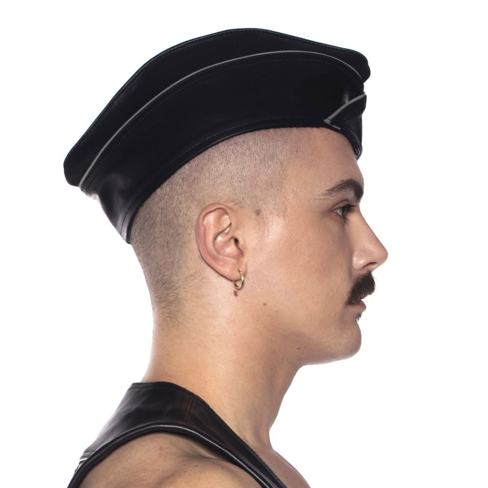 Profile view of a model wearing a Prowler RED Triangle Cap Grey Large 59 cm, showcasing its military-inspired design.