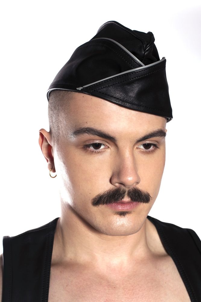 Prowler RED Triangle Cap Grey XL showcased on model, adding style to a leather-inspired outfit.