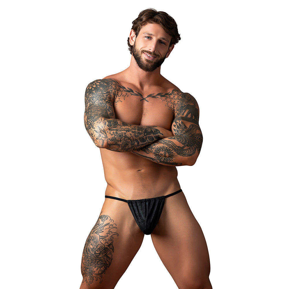 Male Power Kilauea Limited Edition Men's G-String Black on a model showcasing its bold design and secure fit.