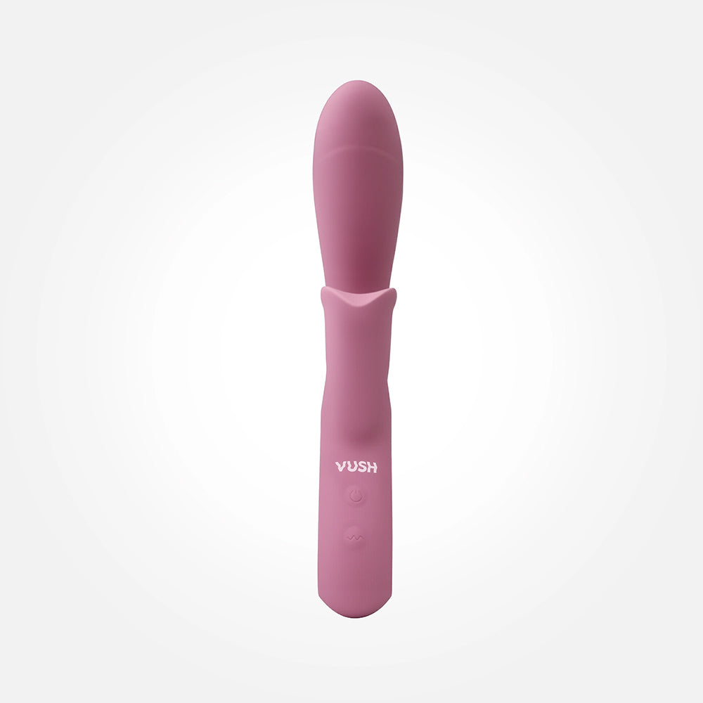 Vush Essentials Dual Rabbit Vibrator in soft pink silicone showcasing dual motors for pleasure.