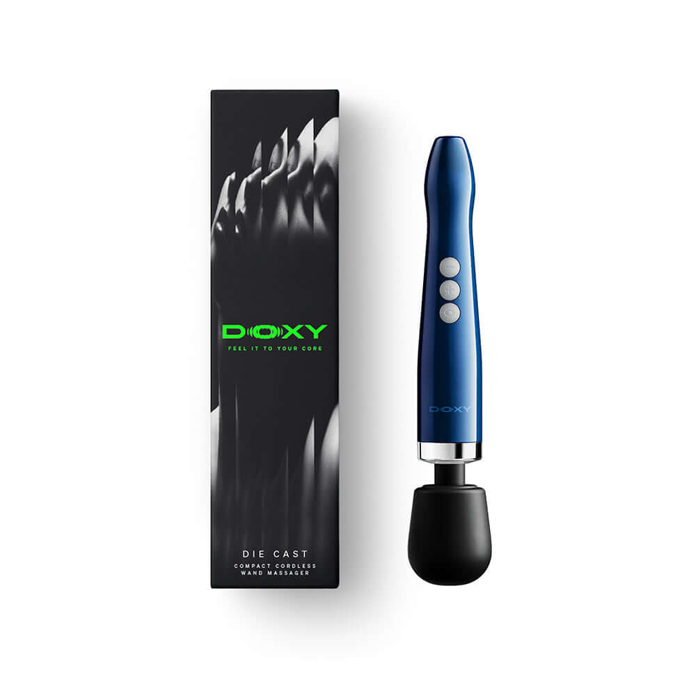 Doxy Die Cast Compact Cordless Wand Massager Blue beside its packaging, showcasing its sleek design and cordless functionality.