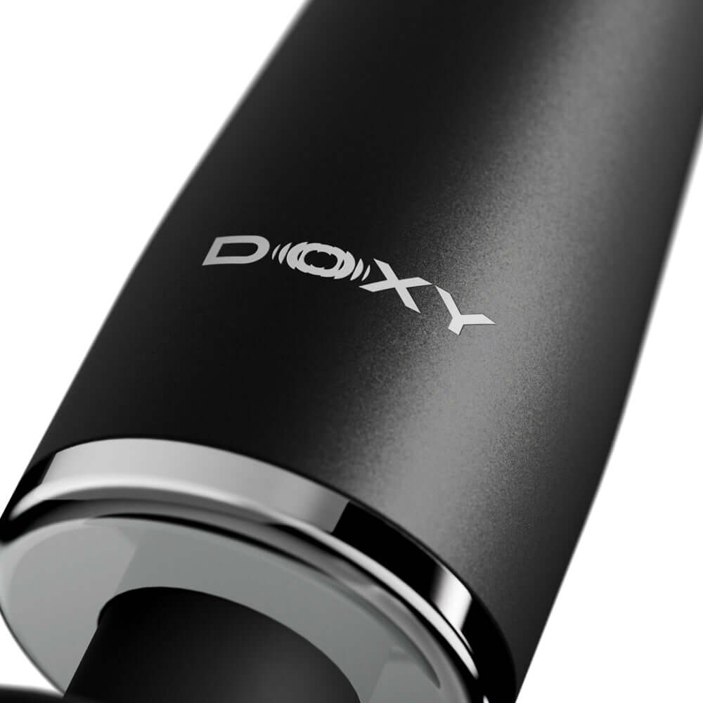 Close-up of Doxy Go Travel-sized Wand Massager Black showing the logo and sleek design.